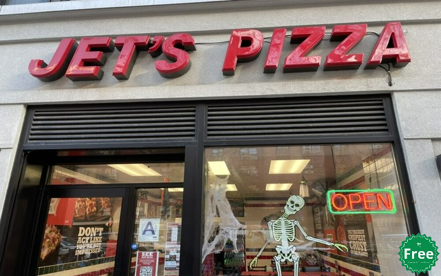 A Jet's Pizza storefront with the company logo