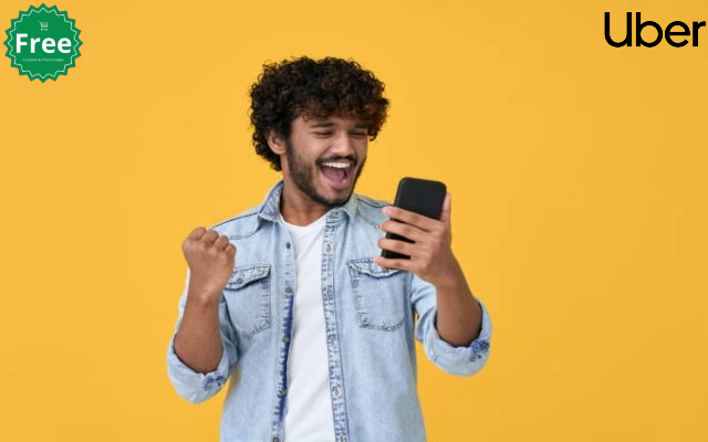 A person cheering with a smartphone in hand, celebrating the successful application of an Uber promo code