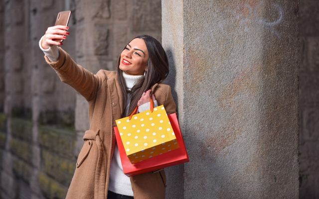 Excited Old Navy shopper showing off their latest finds