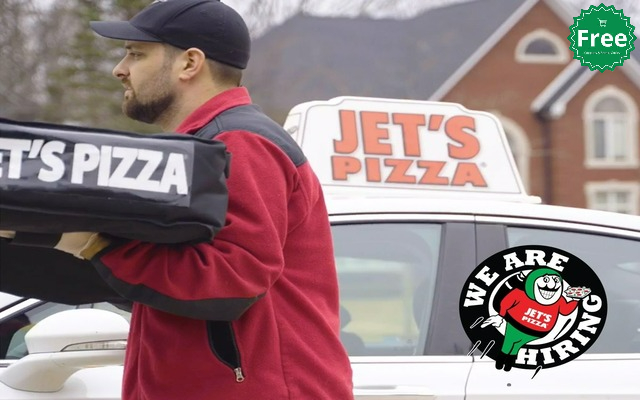 Jet's Pizza delivery driver delivering a pizza to a customer