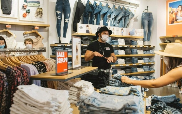 Person shopping in the clearance section of an American Eagle store